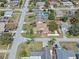 Aerial view of home showcasing well-kept yards, mature trees, and convenient neighborhood access at 1971 Urbana Ave, Deltona, FL 32725