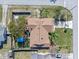 An overhead shot showcases the home's roof, landscaping, fenced yard and the property's overall layout at 1971 Urbana Ave, Deltona, FL 32725