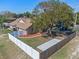 Spacious backyard featuring a vinyl fence, mature trees, and a charming gazebo-covered picnic area at 1971 Urbana Ave, Deltona, FL 32725