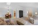 Bright and airy living room, featuring neutral walls, carpet flooring and open to the dining area at 1971 Urbana Ave, Deltona, FL 32725