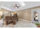 Spacious living room featuring skylight, tiled floor, and access to outside at 1971 Urbana Ave, Deltona, FL 32725