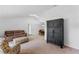 Cozy living room featuring neutral walls, carpet flooring and access to the dining area at 1971 Urbana Ave, Deltona, FL 32725