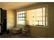 Sunlit bedroom features a large window and simple decor for a relaxing atmosphere at 214 E 18Th St, Sanford, FL 32771