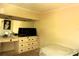 Simple bedroom with built-in vanity featuring a mirror and storage at 214 E 18Th St, Sanford, FL 32771