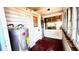View of the home's back porch and water heater at 214 N New Hampshire Ave, Tavares, FL 32778