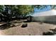 Spacious backyard with mature trees and a fire pit, perfect for outdoor entertaining at 214 N New Hampshire Ave, Tavares, FL 32778