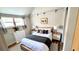 Cozy bedroom with comfortable bed, soft lighting, and charming decor at 214 N New Hampshire Ave, Tavares, FL 32778