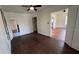 Empty bedroom with hardwood floors, white walls, and simple interior design at 214 N New Hampshire Ave, Tavares, FL 32778
