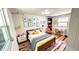 Bedroom featuring a bed, desk, and bright, natural light at 214 N New Hampshire Ave, Tavares, FL 32778