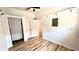 Bright bedroom with hardwood floors and neutral colored walls at 214 N New Hampshire Ave, Tavares, FL 32778