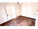 Empty bedroom with hardwood floors and white walls, with plenty of natural light at 214 N New Hampshire Ave, Tavares, FL 32778