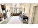 Bedroom featuring painted floors, ample light, a desk, and stylish decor at 214 N New Hampshire Ave, Tavares, FL 32778
