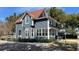 Exterior view of a two story building with gray siding and copper colored roof at 214 N New Hampshire Ave, Tavares, FL 32778