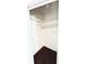 Empty closet with hardwood floors and white shelves, ready for storage and organization at 214 N New Hampshire Ave, Tavares, FL 32778