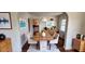 Bright dining room featuring wood floors, white walls, and modern furniture at 214 N New Hampshire Ave, Tavares, FL 32778