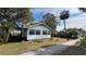 Charming single story home with a manicured lawn at 214 N New Hampshire Ave, Tavares, FL 32778