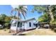Charming home with a classic design, mature trees and a well-maintained lawn at 214 N New Hampshire Ave, Tavares, FL 32778