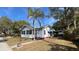 White house with palm tree and walkway at 214 N New Hampshire Ave, Tavares, FL 32778