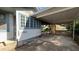 Side view of a house with carport and covered porch at 214 N New Hampshire Ave, Tavares, FL 32778