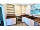 Updated kitchen featuring white cabinets, stainless steel appliances, and wooden countertops at 214 N New Hampshire Ave, Tavares, FL 32778