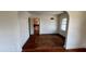 Classic Living Room featuring hardwood floors, arched doorway and large windows for plenty of light at 214 N New Hampshire Ave, Tavares, FL 32778