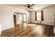 Spacious living room boasts hardwood floors and arched doorway at 214 N New Hampshire Ave, Tavares, FL 32778