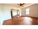 Spacious living room with hardwood floors and ceiling fan at 214 N New Hampshire Ave, Tavares, FL 32778