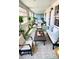 Inviting screened porch featuring seating, decor, and natural light, perfect for relaxation at 214 N New Hampshire Ave, Tavares, FL 32778