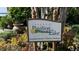 Tavares Pavilion on the Lake sign surrounded by lush greenery and foliage at 214 N New Hampshire Ave, Tavares, FL 32778