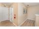 Hallway with wood floors, neutral paint, and access to other rooms at 2153 Calabria Ave, Davenport, FL 33897