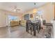 Living room featuring a dining area, hardwood floors, and ample natural light at 2153 Calabria Ave, Davenport, FL 33897