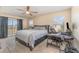 Comfortable main bedroom with ceiling fan, carpet, and sliding glass door to balcony at 2153 Calabria Ave, Davenport, FL 33897