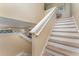 Staircase with white rails and light wood treads at 2153 Calabria Ave, Davenport, FL 33897