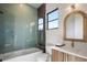 Bright bathroom featuring blue subway tile, a glass enclosed shower, and modern vanity at 2412 Chantilly Ave, Winter Park, FL 32789