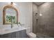 Modern bathroom with a stylish vanity, unique mirror, and glass-enclosed shower at 2412 Chantilly Ave, Winter Park, FL 32789