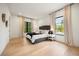Spacious bedroom with plush carpeting, large windows, and neutral decor at 2412 Chantilly Ave, Winter Park, FL 32789