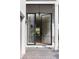 Front door that is a glass panel door with a view looking into the dinning and backyard at 2412 Chantilly Ave, Winter Park, FL 32789