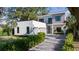 Two-story modern home with clean lines, a stone driveway, and low maintenance landscaping at 2412 Chantilly Ave, Winter Park, FL 32789