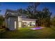 Aerial shot of home shows the backyard, in-ground pool, outdoor living area and surrounding landscaping at 2412 Chantilly Ave, Winter Park, FL 32789