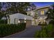 Contemporary two-story home featuring a two-car garage and well-manicured landscaping at 2412 Chantilly Ave, Winter Park, FL 32789