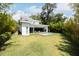 Modern home with a spacious backyard, inviting pool, and lush greenery, perfect for outdoor living at 2412 Chantilly Ave, Winter Park, FL 32789