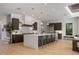 Bright kitchen with an expansive island, modern cabinetry, and stainless steel appliances at 2412 Chantilly Ave, Winter Park, FL 32789
