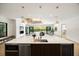 Spacious kitchen featuring an island with a sink, modern appliances, and seamless connection to the living area at 2412 Chantilly Ave, Winter Park, FL 32789