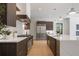 Well-equipped kitchen featuring an island, stainless steel appliances, and a modern design at 2412 Chantilly Ave, Winter Park, FL 32789