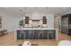 Spacious kitchen island with seating, modern fixtures, and stainless steel appliances at 2412 Chantilly Ave, Winter Park, FL 32789