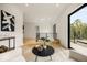 Bright living area with modern decor, comfortable seating, and large windows showcasing outdoor views at 2412 Chantilly Ave, Winter Park, FL 32789