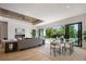 Inviting living area with a sleek fireplace, comfortable seating, and sliding glass doors leading to outdoor living spaces at 2412 Chantilly Ave, Winter Park, FL 32789