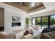 Cozy living room with fireplace, modern decor, and sliding doors to the outdoor pool at 2412 Chantilly Ave, Winter Park, FL 32789