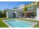 Stunning backyard featuring a modern pool with lounge area and an open-concept design at 2412 Chantilly Ave, Winter Park, FL 32789