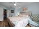 Inviting bedroom with a coastal theme, featuring a comfortable bed and convenient access to the closet at 2521 Grassy Point Dr # 309, Lake Mary, FL 32746